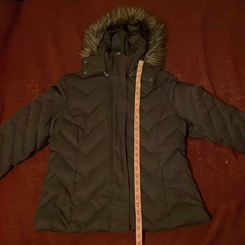 Jacket the label says size XL but it looks smaller it is shown with measurements